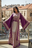 Elegant & Bold Palestinian Thoub glow amidst city colors.