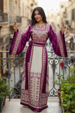 Elegant & Bold Palestinian Thoub glow amidst city colors.