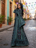 Elegant & Bold Emerald Palestinian Thoub glow amidst city colors.