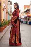 Maroon Velvet embellished with intricate Qasab (metallic) embroidery.