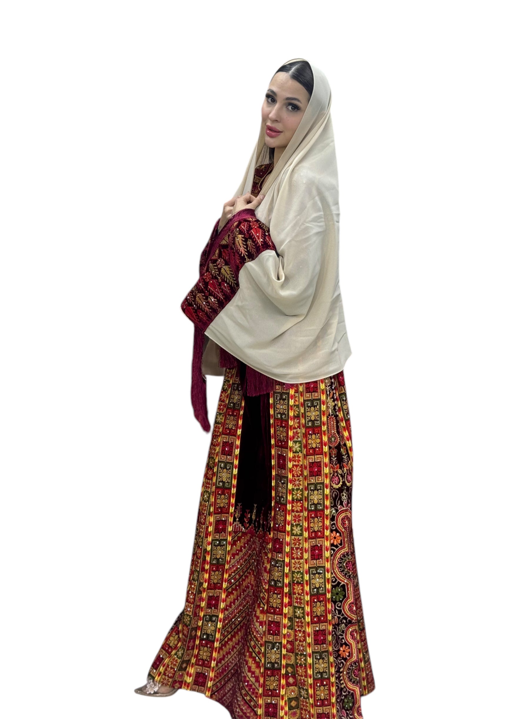 Maroon velvet Palestinian embroidered traditional long thobe with matching headpiece.