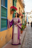 Elegant & Bold Palestinian Thoub glow amidst city colors.