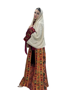 Maroon velvet Palestinian embroidered traditional long thobe with matching headpiece.